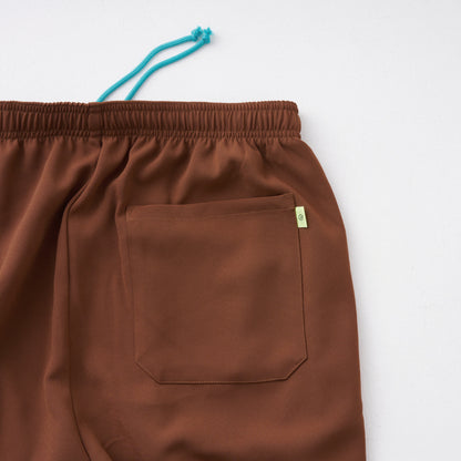 track pants / brown
