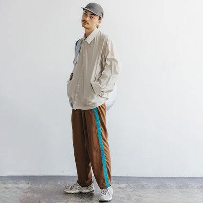 track pants / brown